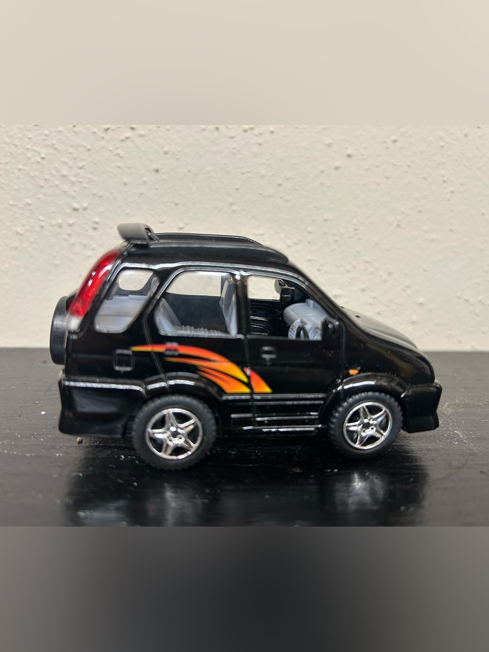Vintage Toyota Cami Black Toy SUV with Orange Flame Decal - collectible